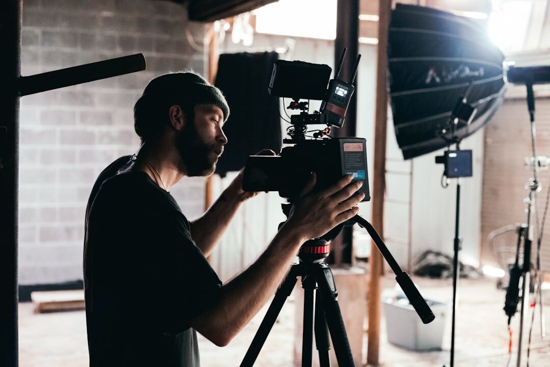 Person recording video content with professional camera